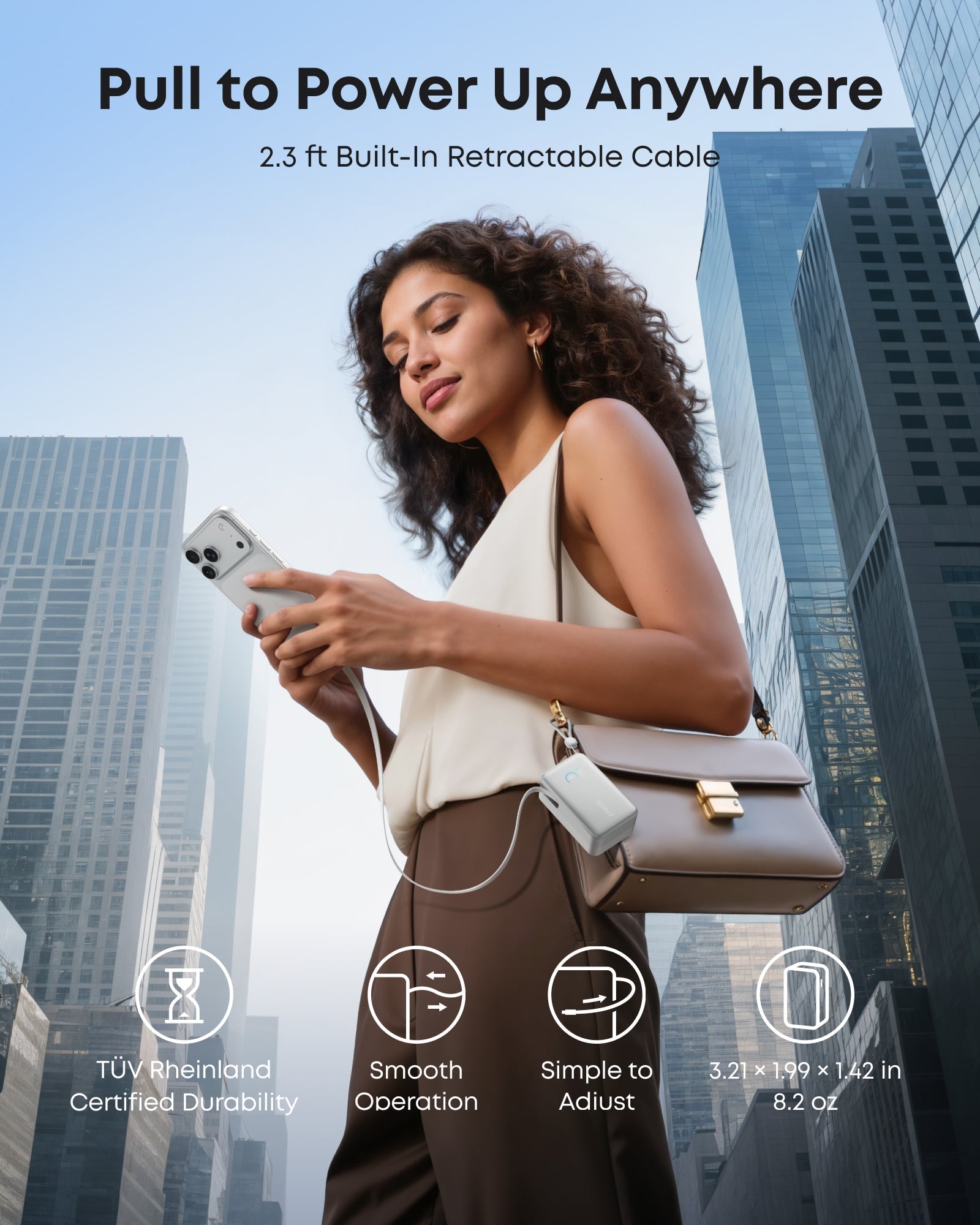 Anker portable power bank with retractable cable for city charging.