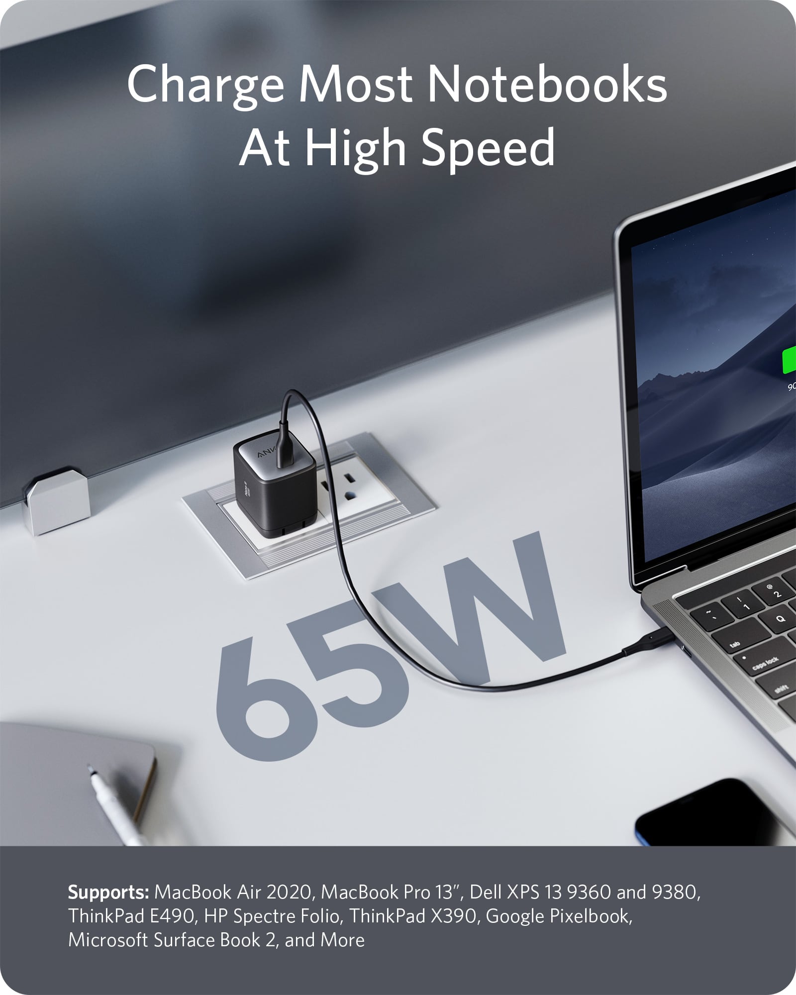 Anker charger powering a notebook with 65W high-speed charging