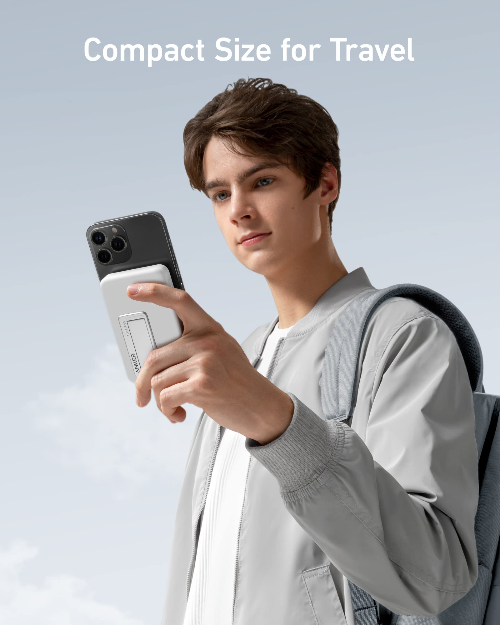 Anker portable charger with iPhone for compact travel.